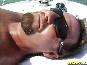 Welcome to the great group fuck party this brunette MILF is enjoying on the boat. Her passionate lovers are presenting her with wild double penetration.