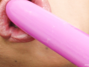 It's a great pleasure for this tender brunette to bang herself with long pink dildo. She is pushing this toy deep into her juicy holes in bed.