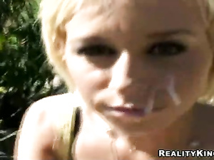 Fucking in the street is what this tanned blonde really loves. She is taking off her black sunglasses and getting her face covered with cumshot.