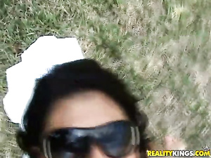 Say Hi to lovely brunette wearing black sunglasses and sunbathing outdoor. Her partner is pushing his penis deep in her tanned holes.