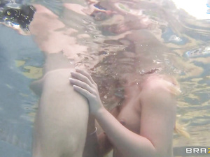 Turn on this clip to see passionate lovers fucking wildly in the swimming pool. The bald guy can't stop penetrating wet holes of the busty blonde.