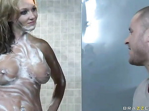 Muscular guy is enjoying fuck session with the redhead lady in the shower. He is getting his wet dick sucked and penetrating her juicy vagina.