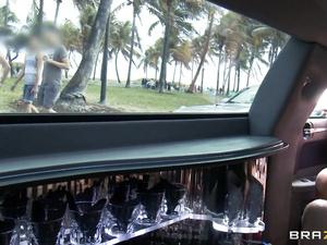 Big comfortable limousine is a great place for having passionate group sex. Watch young man banging two juicy babes with big tits there.
