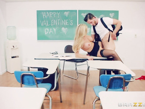 Handsome student is getting presented with deep BJ by his beautiful blonde teacher. She is also letting him drill her twat on the desk.