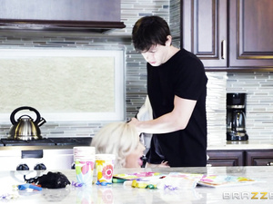 Blond-haired beauty in a plaid shirt gets banged from behind. This guy happily fucks her pussy all over the place, including the kitchen counter.