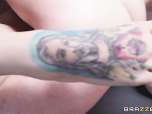 Ginger lady having colorful tattoos is demonstrating her fantastic sex skills. She is riding her partner's dick and giving him awesome blowjob.