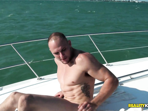 Strong captain is famous for his thick penis. He is enjoying awesome sex session with two horny sluts on his expensive boat with pleasure.