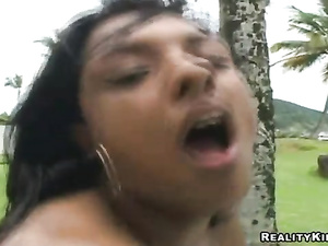 Tanned girl having small tits is doing her best to satisfy her lover. She is presenting him with oral sex and getting fucked hard outdoor.