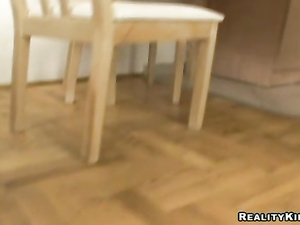 Fucking in the kitchen is what this adorable brunette really loves. She is getting her shaved cunt drilled on the table and sucking her partner's cock.